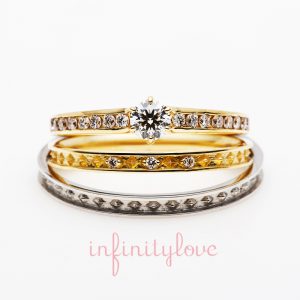アンティーク調が可愛いエタニティデザインの婚約指輪と結婚指輪のセットリングです。