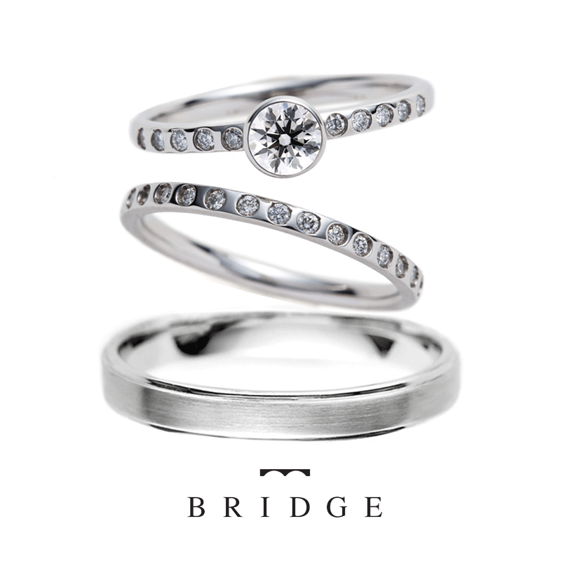 女性用はダイヤモンドラインの結婚指輪ロンドン留で引っかかりなく普段使いもＯＫ男性用は直線的で硬派な印象が人気　婚約指輪は覆輪留めが可愛いデザインです