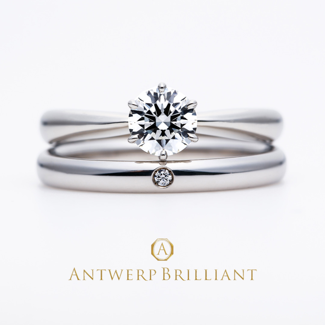 シンプルなソリテールデザインの婚約指輪と結婚指輪の重ね付け